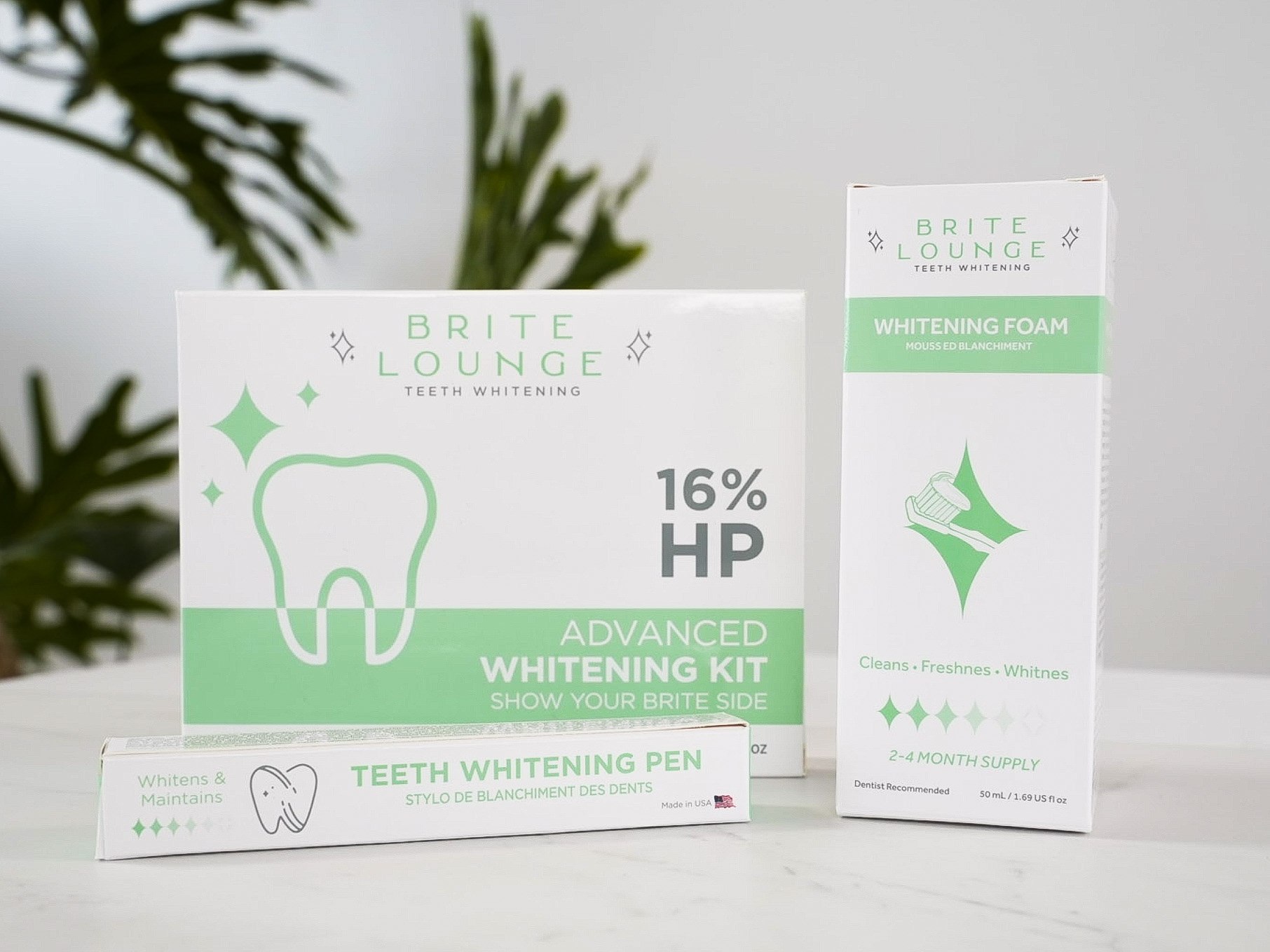The Advanced Kit, the whitening pen and the whitening foam in their Brite Lounge cartons