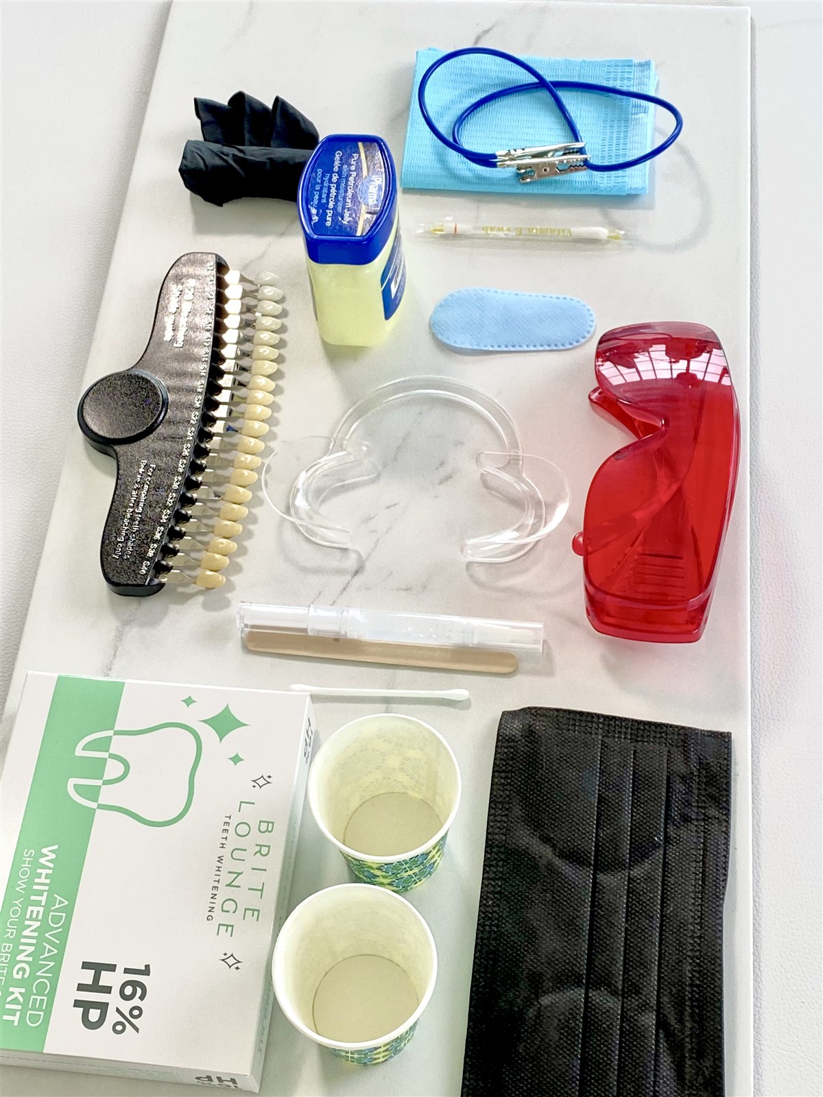 The contents of a Brite Lounge whitening kit laid out